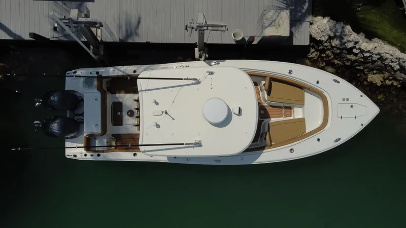 Slide: The Image of Aerial view of 2020 Sea Hunt Gamefish 30 boat docked, featuring forward seating and twin engines. - 9