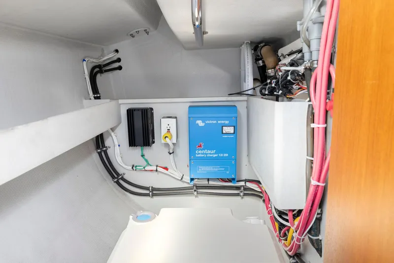 Slide: The Image of Electrical system inside a 2004 Wyliecat 30 sailboat, featuring a Centaur battery charger. - 26