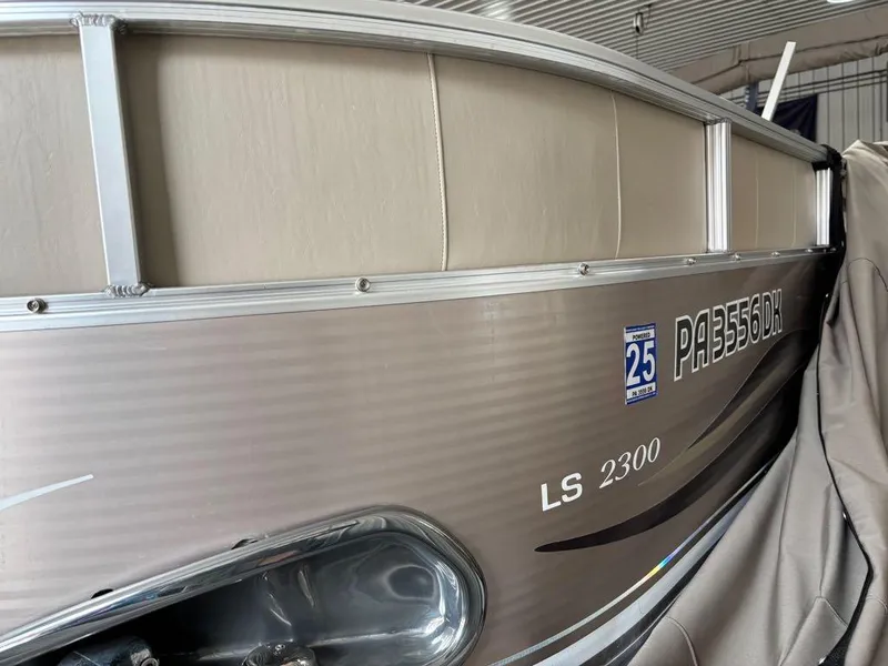 Slide: The Image of 2011 Avalon LS 2300 RE boat with registration number PA3556DK in a storage facility. - 6