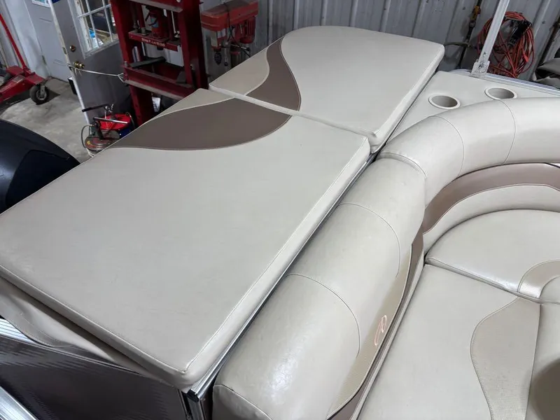 Slide: The Image of Luxurious seating on 2011 Avalon LS 23' RE boat with beige upholstery and cup holders. - 7
