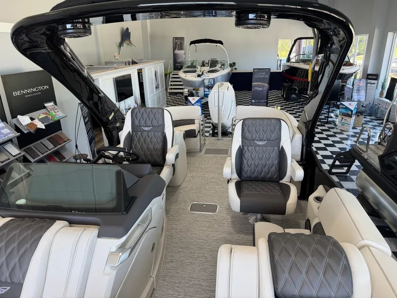 Slide: The Image of Interior of a 2025 Bennington 25QFBA boat with luxurious seating and modern design. - 11