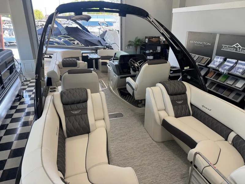 Slide: The Image of 2025 Bennington 25QFBA luxury pontoon boat interior with plush seating and modern design. - 16