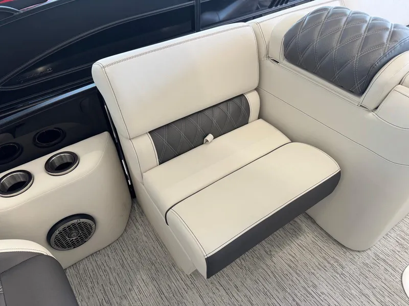 Slide: The Image of Luxurious seating on 2025 Bennington 25QFBA boat with cup holders and speaker. - 18