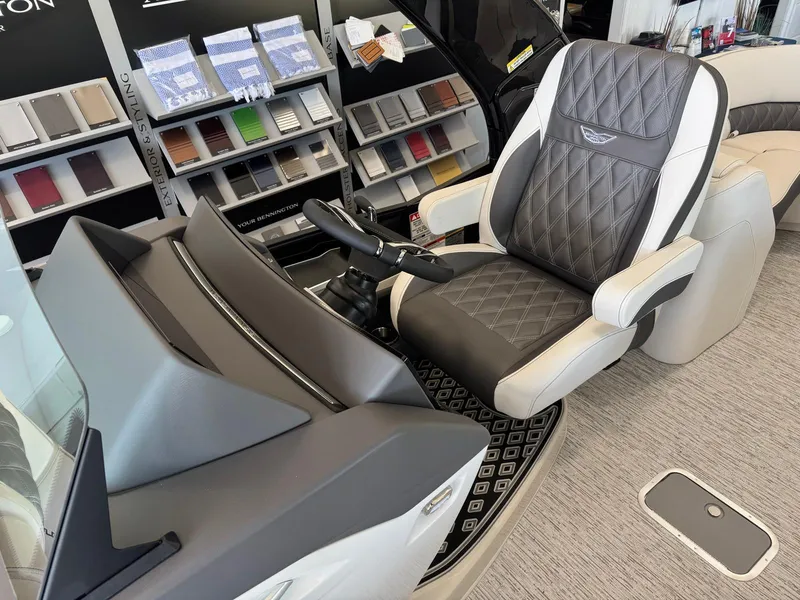 Slide: The Image of Captain's chair in a 2025 Bennington 25QFBA boat, showcasing luxury design and comfort. - 20