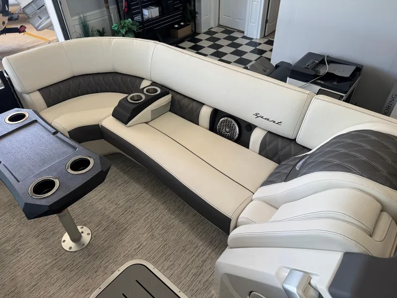 Slide: The Image of Luxurious seating on 2025 Bennington 25QFBA boat with cup holders and stylish upholstery. - 24