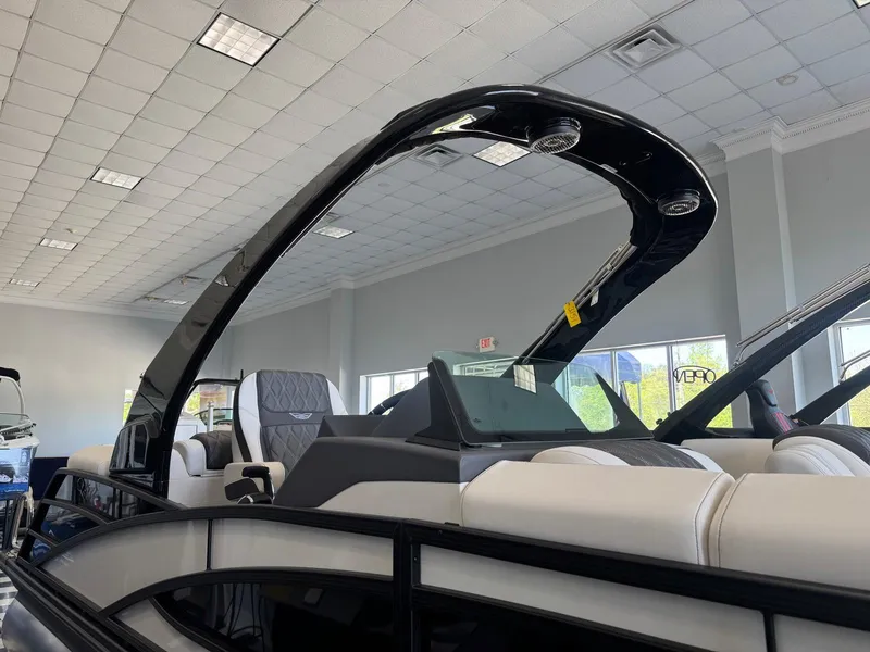 Slide: The Image of 2025 Bennington 25QFBA pontoon boat interior with sleek design and modern seating. - 4