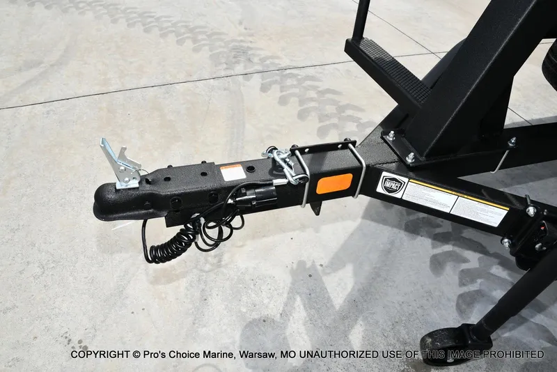 Slide: The Image of Trailer hitch of 2025 Sun Tracker Bass Buggy 16 DLX, shown on concrete surface. - 16