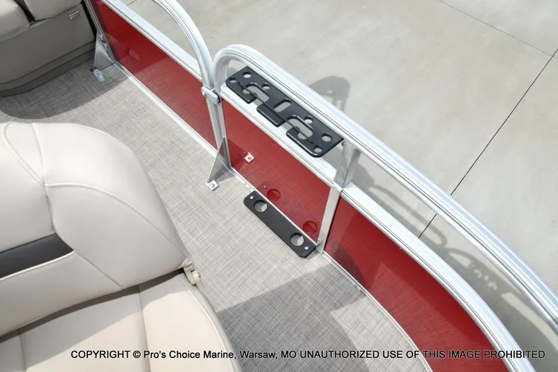 Slide: The Image of 2025 Sun Tracker Bass Buggy 16 DLX interior with beige seating and red paneling. - 21