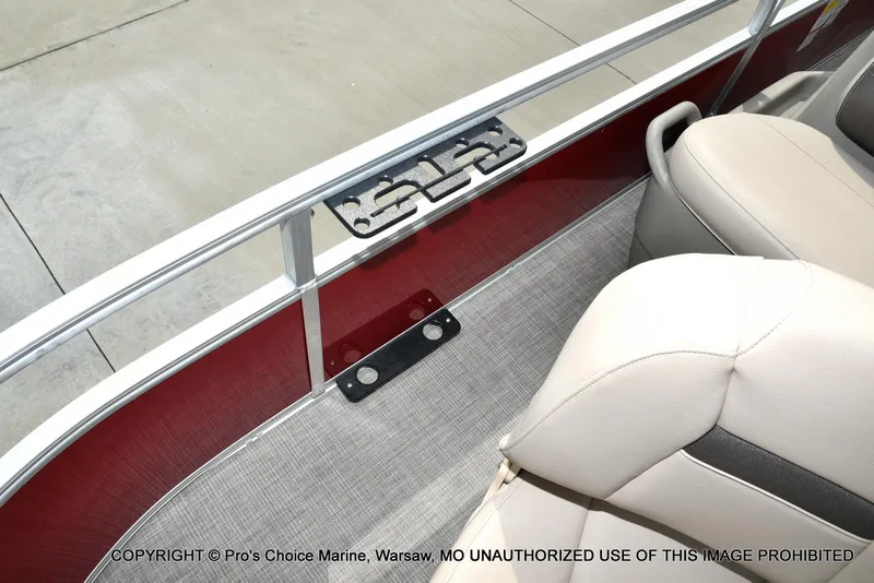 Slide: The Image of 2025 Sun Tracker Bass Buggy 16 DLX interior with beige seating and red paneling. - 24