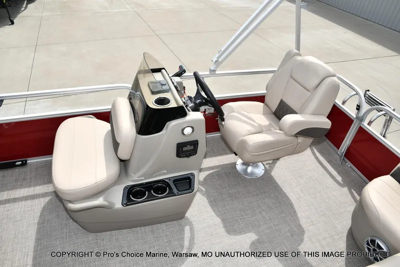 Slide: The Image of 2025 Sun Tracker Bass Buggy 16 DLX interior with beige seating and control console. - 27