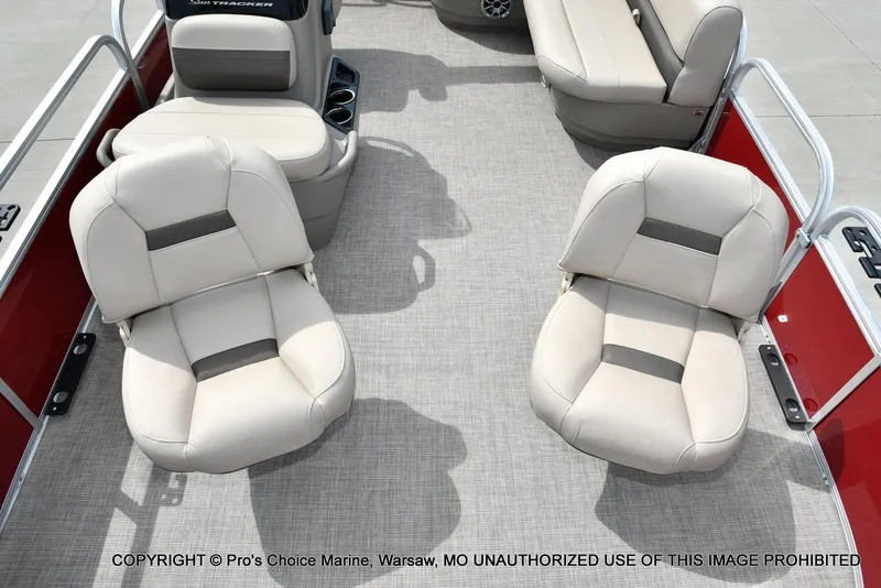 Slide: The Image of 2025 Sun Tracker Bass Buggy 16 DLX interior with beige seating and red accents. - 3