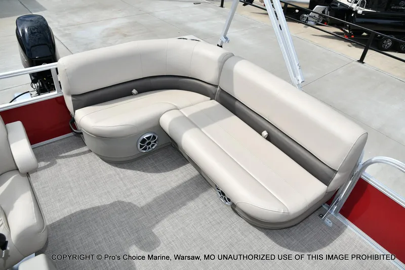 Slide: The Image of 2025 Sun Tracker Bass Buggy 16 DLX interior seating with beige upholstery and speaker system. - 5