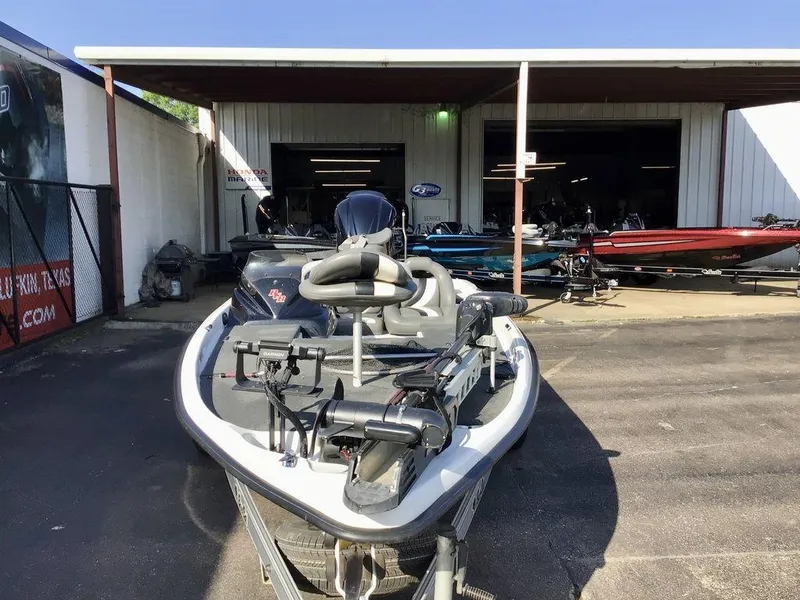 Slide: The Image of 2018 Bass Cat Panterra II boat parked outside a dealership. - 11