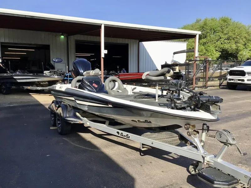Slide: The Image of 2018 Bass Cat Panterra II boat on trailer outside a service shop. - 12