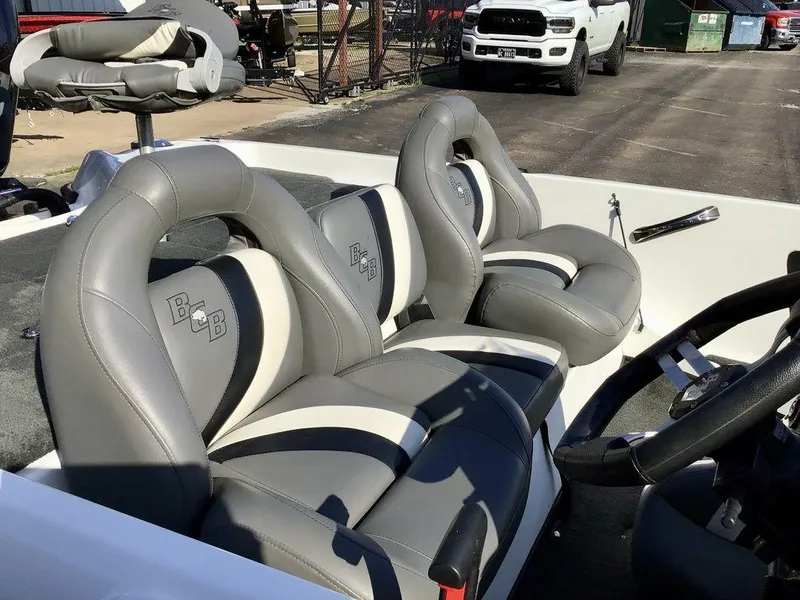 Slide: The Image of 2018 Bass Cat Panterra II boat interior with gray and white leather seats. - 16