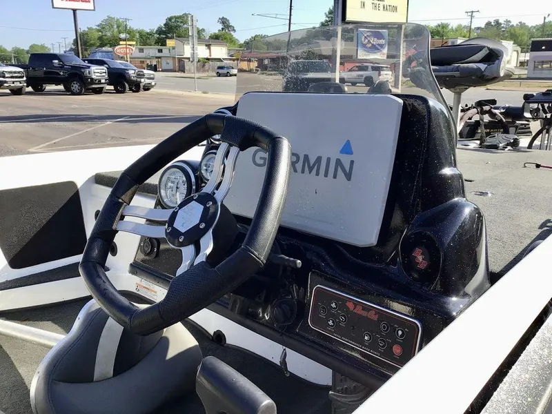 Slide: The Image of 2018 Bass Cat Panterra II boat dashboard with Garmin navigation system. - 17