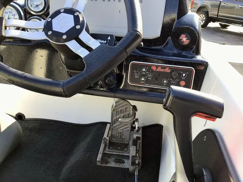 Slide: The Image of 2018 Bass Cat Panterra II boat dashboard with steering wheel and control panel. - 19