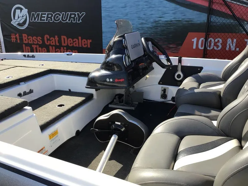 Slide: The Image of 2018 Bass Cat Panterra II boat interior with Garmin system and Mercury branding. - 31