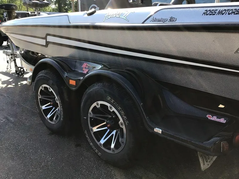 Slide: The Image of 2018 Bass Cat Panterra II boat trailer with dual wheels and sleek design. - 33