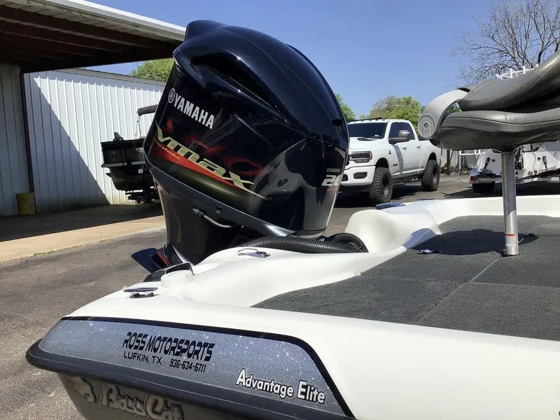 Slide: The Image of 2018 Bass Cat Panterra II boat with Yamaha engine, parked outdoors near a white truck. - 40