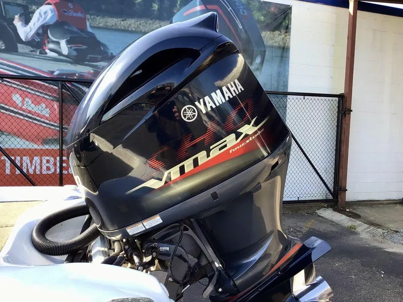 Slide: The Image of 2018 Bass Cat Panterra II with Yamaha VMAX outboard motor, parked outdoors. - 6