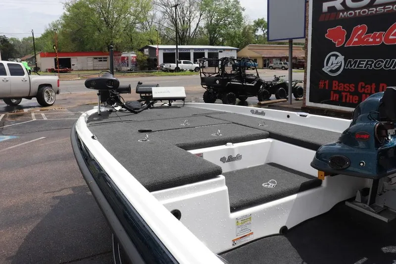 Slide: The Image of 2021 Bass Cat Pantera II boat with fishing deck and equipment, parked outdoors. - 11