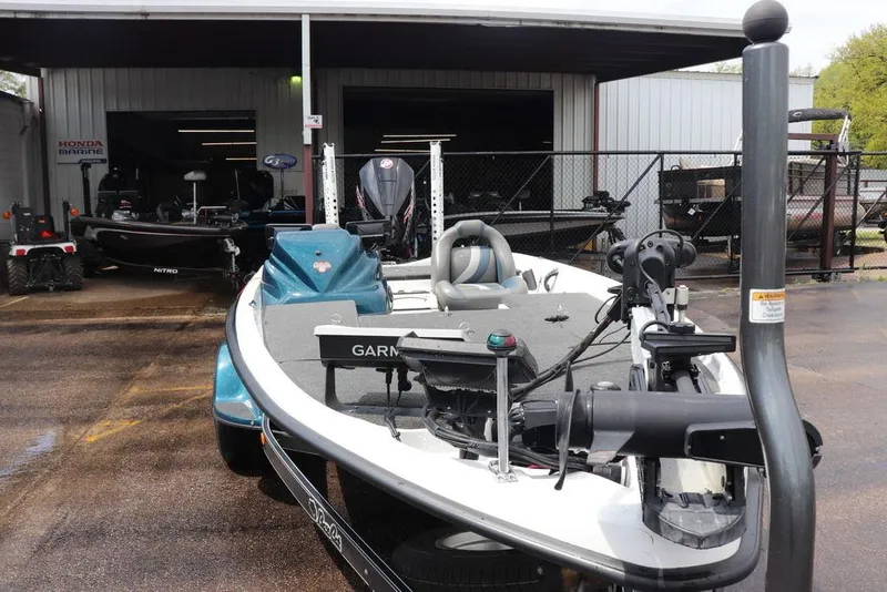 Slide: The Image of 2021 Bass Cat Pantera II boat with Garmin equipment, parked outside a marine shop. - 15