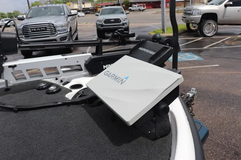 Slide: The Image of 2021 Bass Cat Pantera II boat with Garmin and Humminbird electronics, parked in a lot. - 16