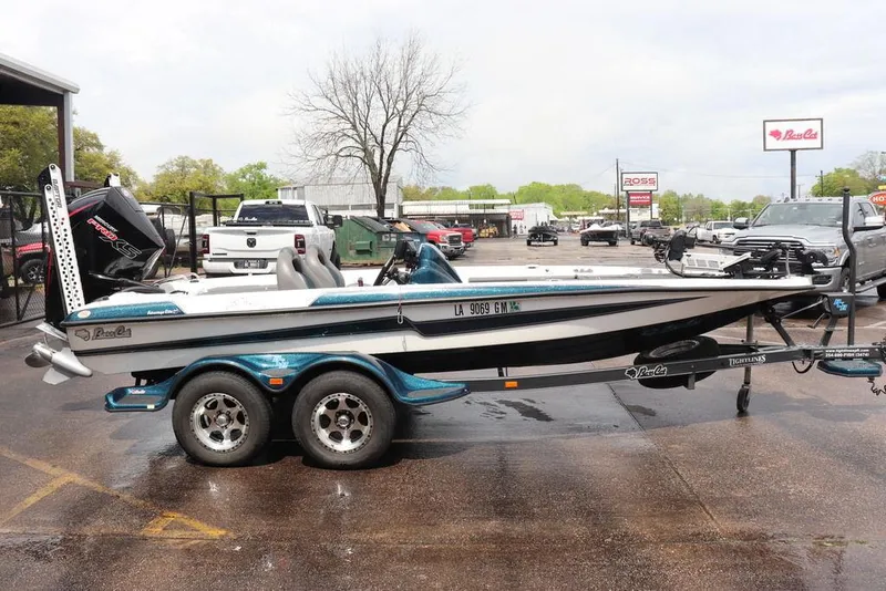 Slide: The Image of 2021 Bass Cat Pantera II boat on trailer in parking lot. - 19