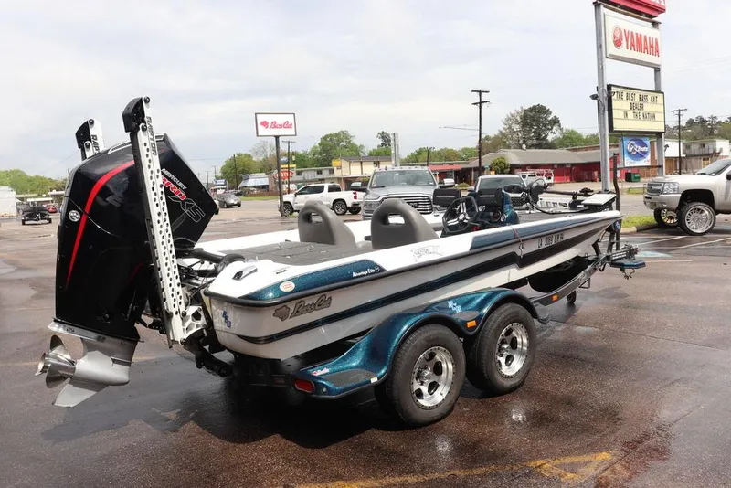 Slide: The Image of 2021 Bass Cat Pantera II boat with powerful engine, parked at dealership. - 20
