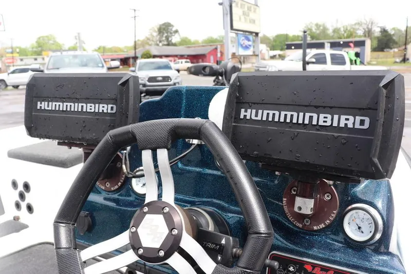 Slide: The Image of 2021 Bass Cat Pantera II boat dashboard with dual Humminbird fish finders. - 26