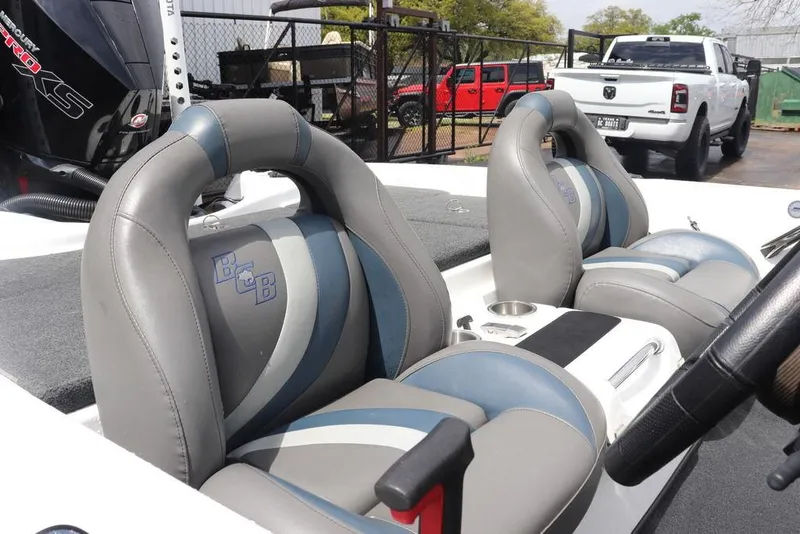 Slide: The Image of 2021 Bass Cat Pantera II boat interior with gray and blue seats. - 27