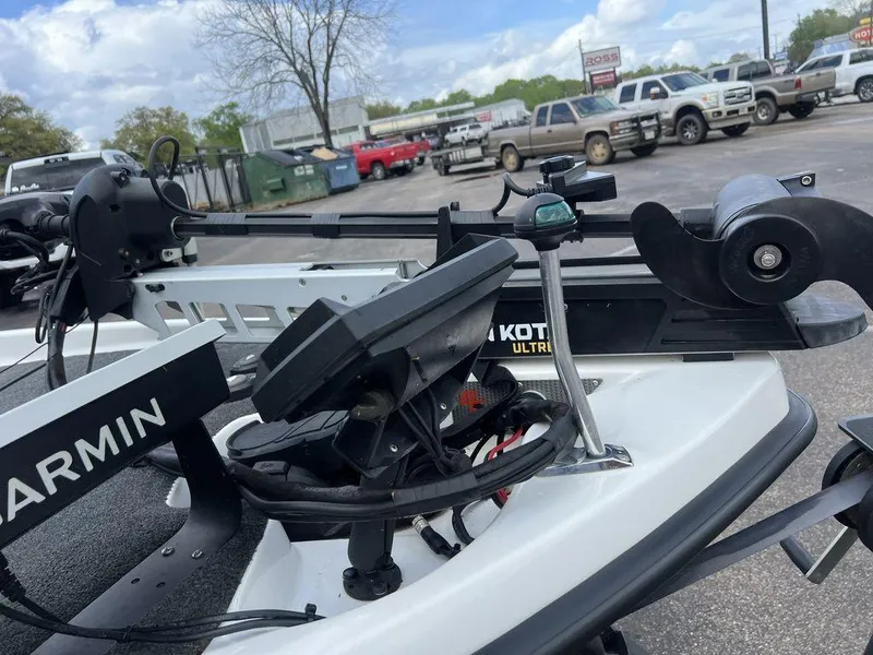 Slide: The Image of 2021 Bass Cat Pantera II boat with Garmin and Minn Kota equipment in a parking lot. - 42