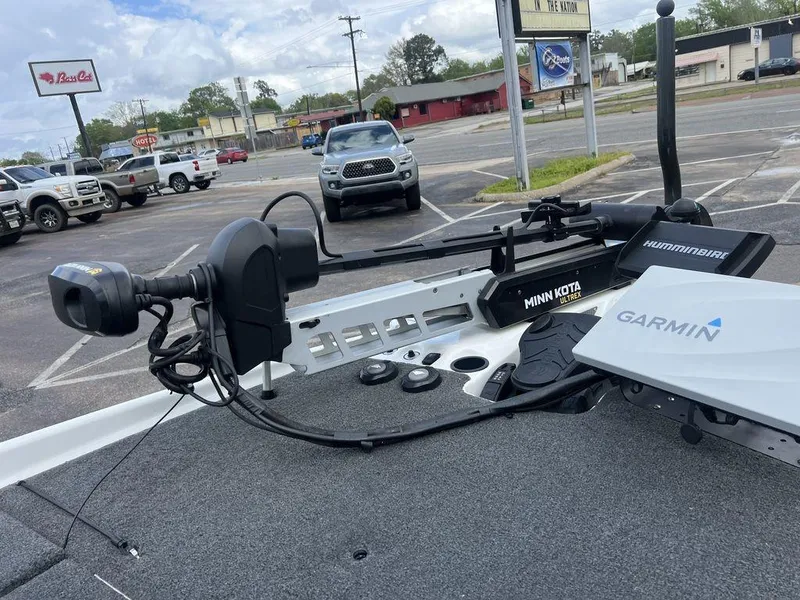 Slide: The Image of 2021 Bass Cat Pantera II boat with Minn Kota and Garmin equipment in a parking lot. - 46