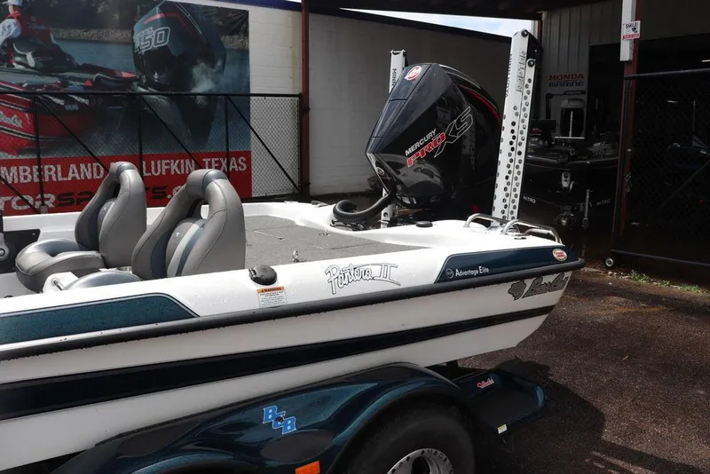Slide: The Image of 2021 Bass Cat Pantera II boat with Mercury Pro XS engine, parked outdoors. - 7