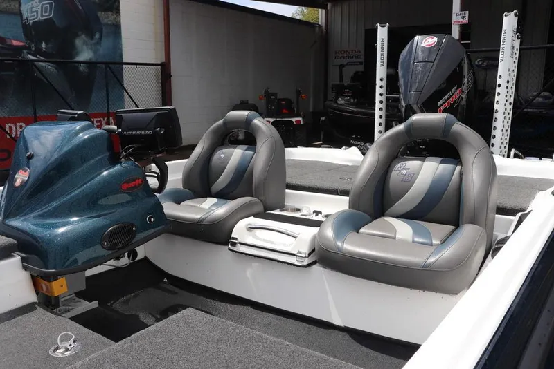 Slide: The Image of 2021 Bass Cat Pantera II boat interior with dual seats and steering console. - 8