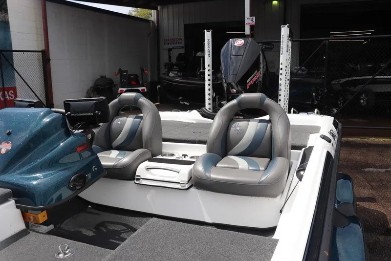 Slide: The Image of 2021 Bass Cat Pantera II boat interior with dual seats and advanced navigation system. - 9