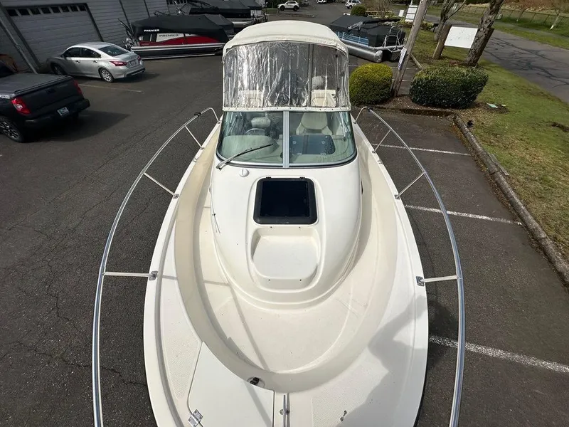 Slide: The Image of 2002 Trophy boat in parking lot, top view, with windshield and open hatch. - 10