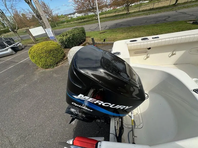 Slide: The Image of Boat with Mercury Optimax engine, parked outdoors, Trophy 2002 model. - 11