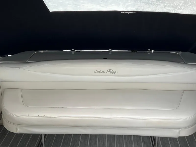 Slide: The Image of 2005 Sea Ray 290 Amberjack boat interior with white seating. - 6