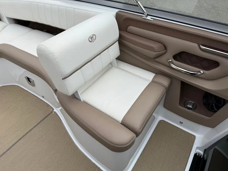 Slide: The Image of Luxurious interior of a 2013 Cobalt 273 boat with beige and white seating. - 18