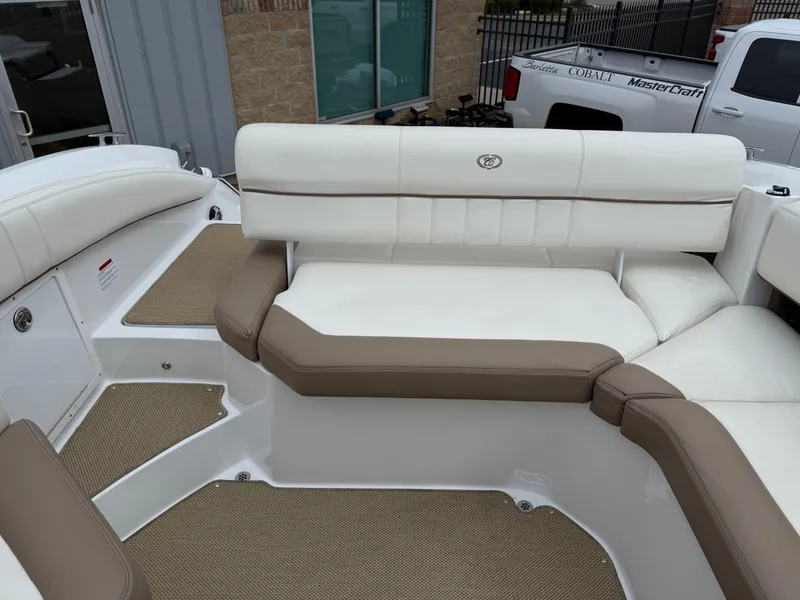 Slide: The Image of 2013 Cobalt 273 boat interior with beige and white seating. - 20