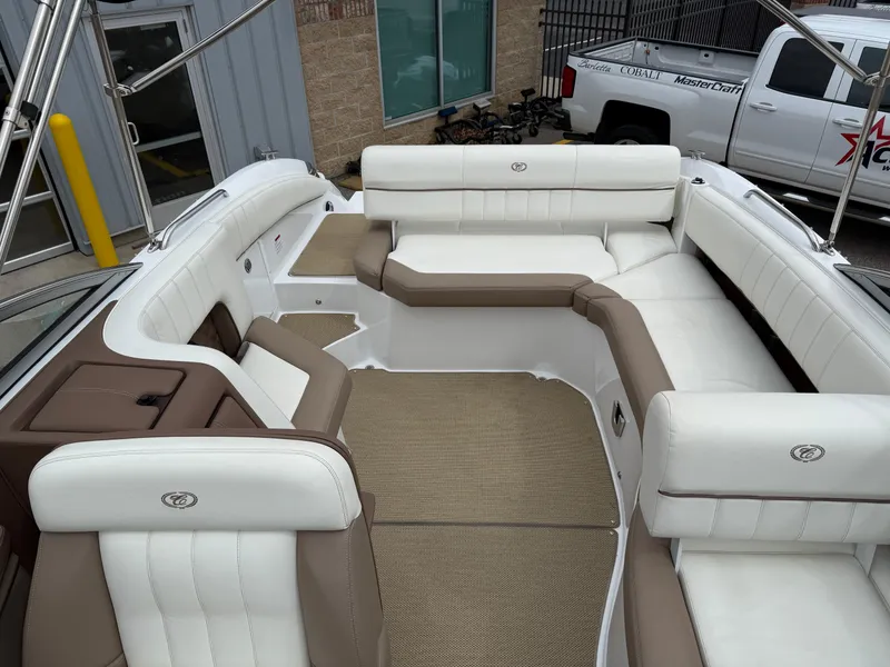 Slide: The Image of Interior of a 2013 Cobalt 273 boat with white and brown seating. - 22