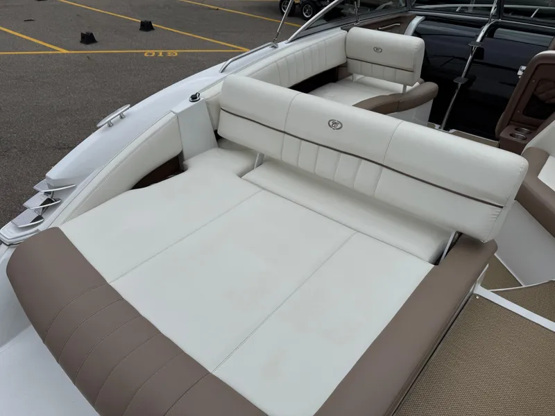 Slide: The Image of 2013 Cobalt 273 boat interior with white and brown leather seating. - 8