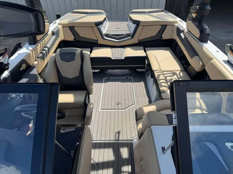 Slide: The Image of Luxurious interior of 2022 Nautique Super Air Nautique G21 boat with beige seating. - 3