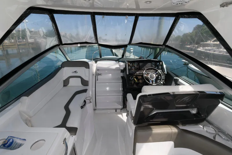 Slide: The Image of 2019 Monterey 295 Sport Yacht interior with sleek design and modern cockpit. - 6