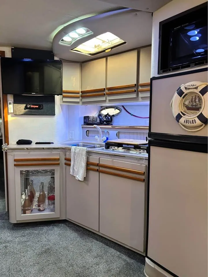 Slide: The Image of 1989 Cruisers Yachts 3670 Esprit interior with modern kitchen and appliances. - 7