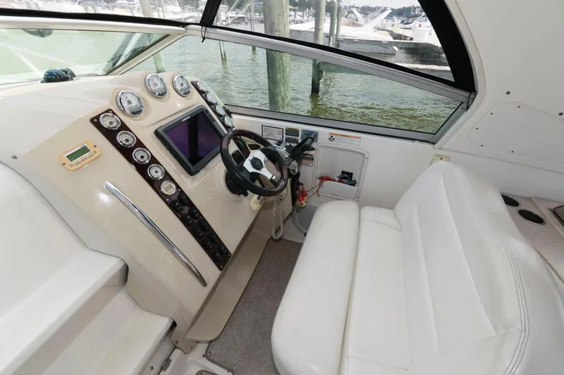 Slide: The Image of 2008 Maxum 2900 SE boat cockpit with steering wheel and control panel. - 6