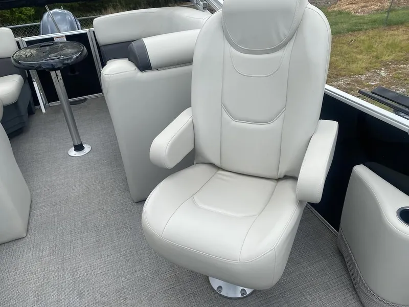 Slide: The Image of Luxurious seating on 2023 Sylvan 822 LZ Mirage pontoon boat, featuring plush white upholstery. - 7