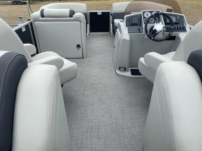Slide: The Image of 2023 Sylvan 822 LZ Mirage pontoon boat interior with plush seating and modern helm. - 8